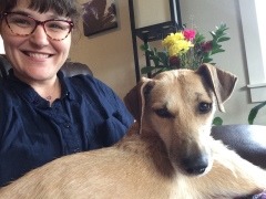 A picture of a woman and her dog